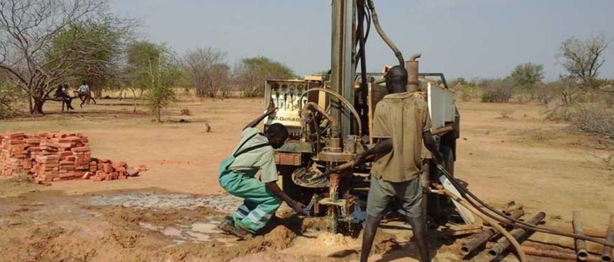 A drilling rig and crew at work on a borehole